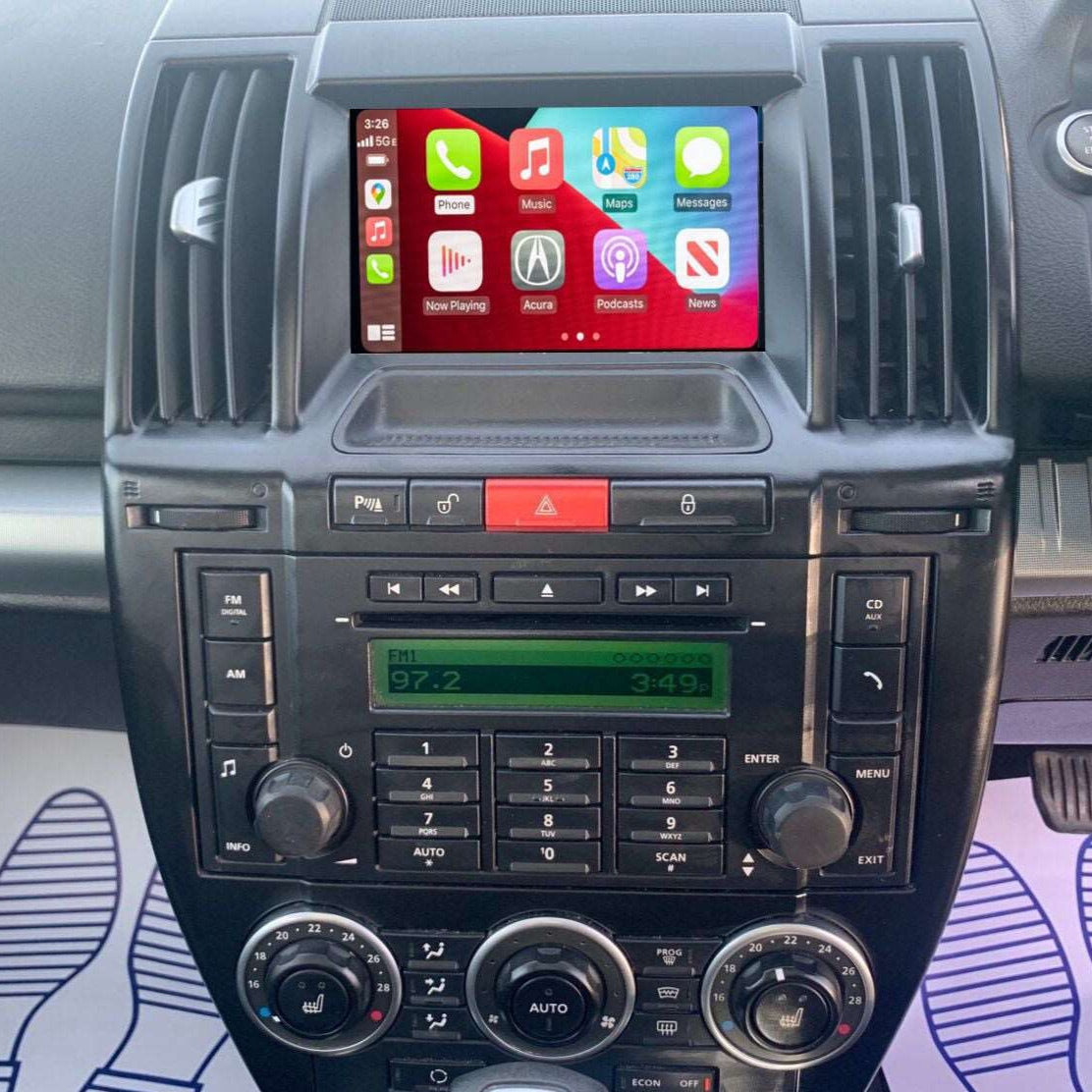 Land Rover Discovery interior showing the integrated wireless Apple CarPlay interface on the infotainment screen.
