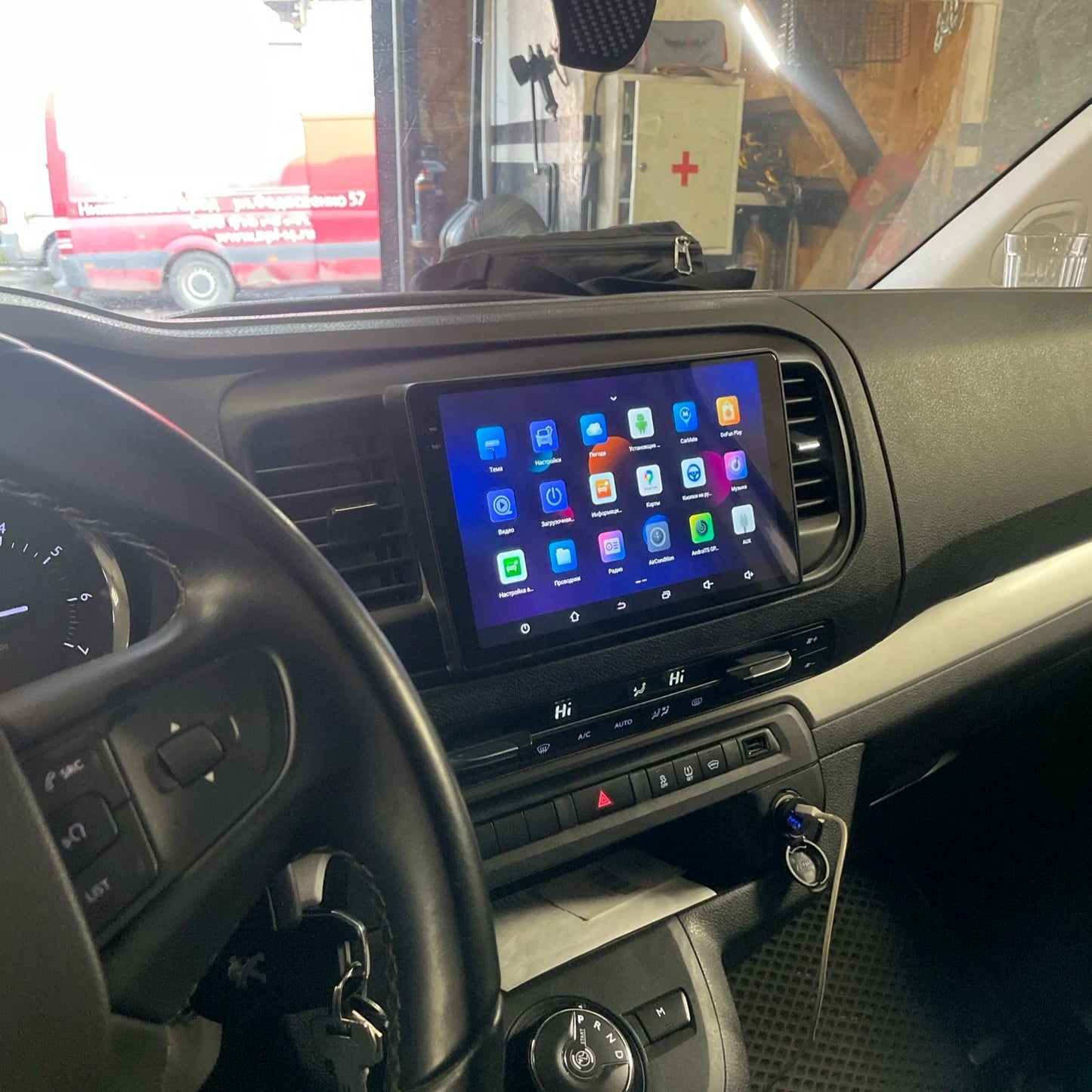Integrated Android car screen installed in a vehicle dashboard, displaying a user interface with various application icons for enhanced in-car connectivity.