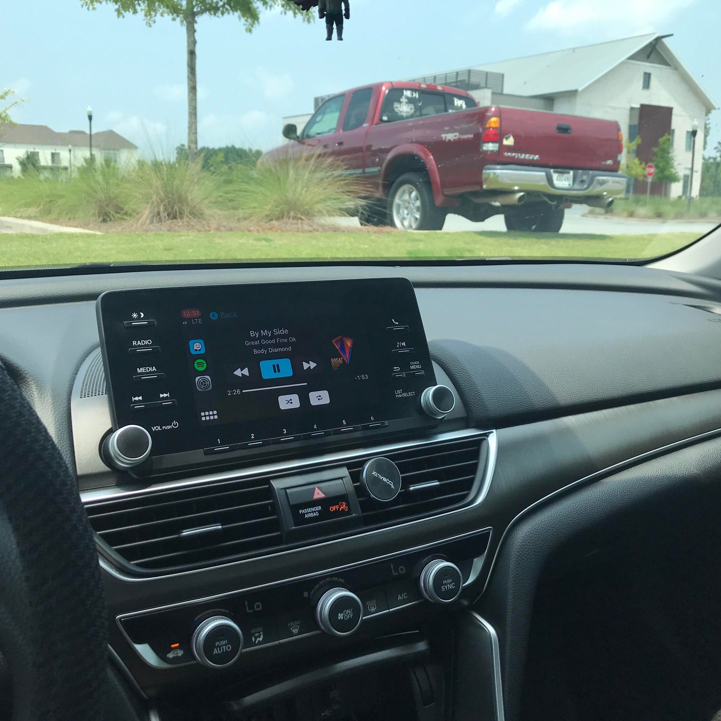 Honda car interior showing the integrated wireless Apple CarPlay or Android Auto system display on the infotainment screen.